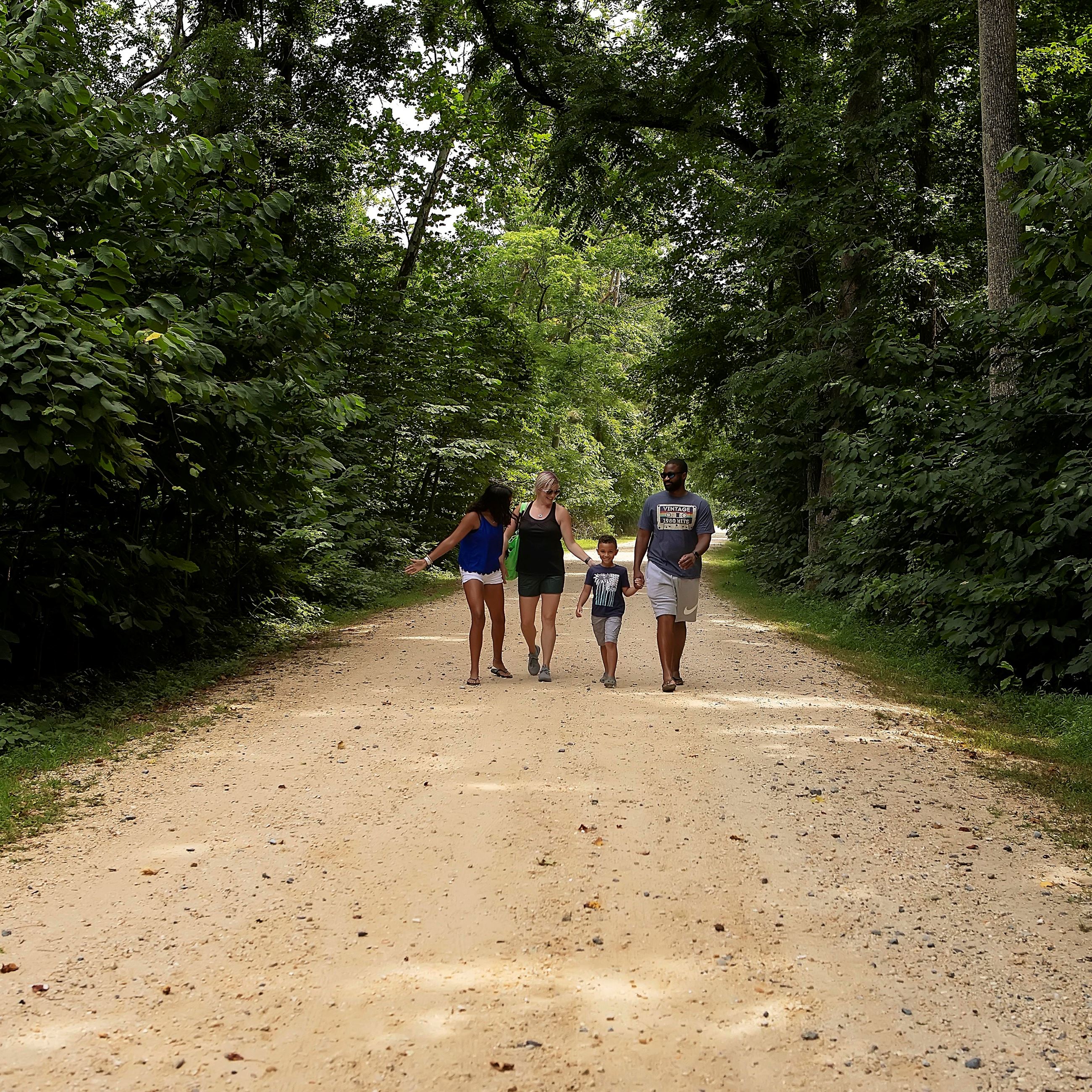 Family walking the trail at Flag Ponds 