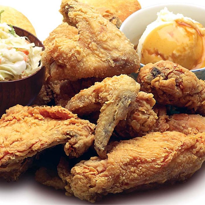Fried chicken, mashed potatoes and gravy, biscuits and coleslaw