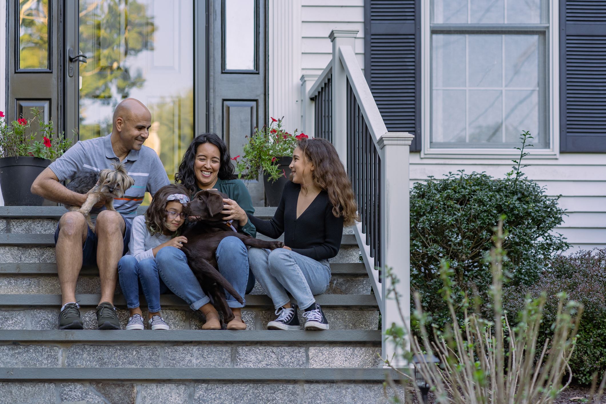 Family in Front of House