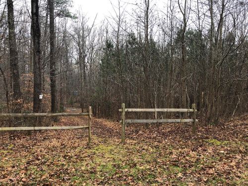 Trailhead fence at Hughes Tree Farm